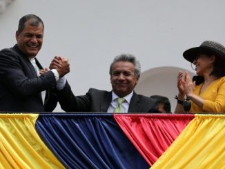 Ecuador's President Rafael Correa (L) greets Presidential candidate Lenin Moreno (C) next to his wife Rocio Gonzalez as they stand on the government palace's balcony during a military change of guard ceremony in Quito, Ecuador April 3, 2017. REUTERS/Mariana Bazo